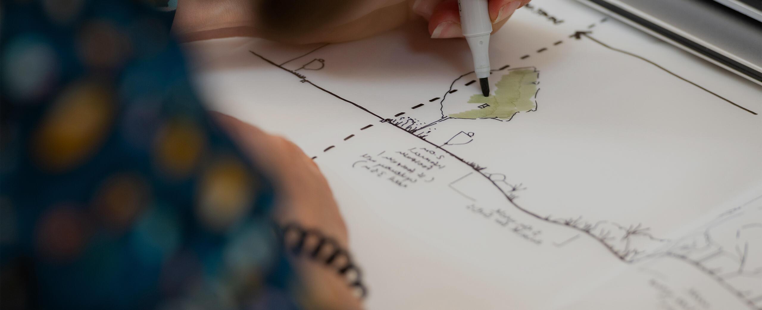 A photograph of a landscape sketch in progress