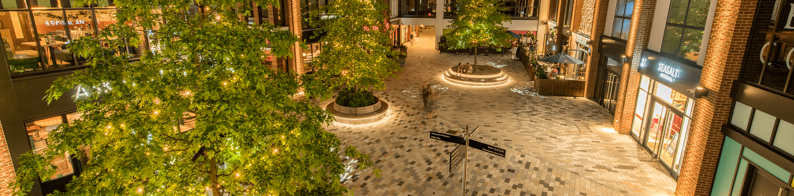 An aerial photograph of Bell Court lit at night. © BMD