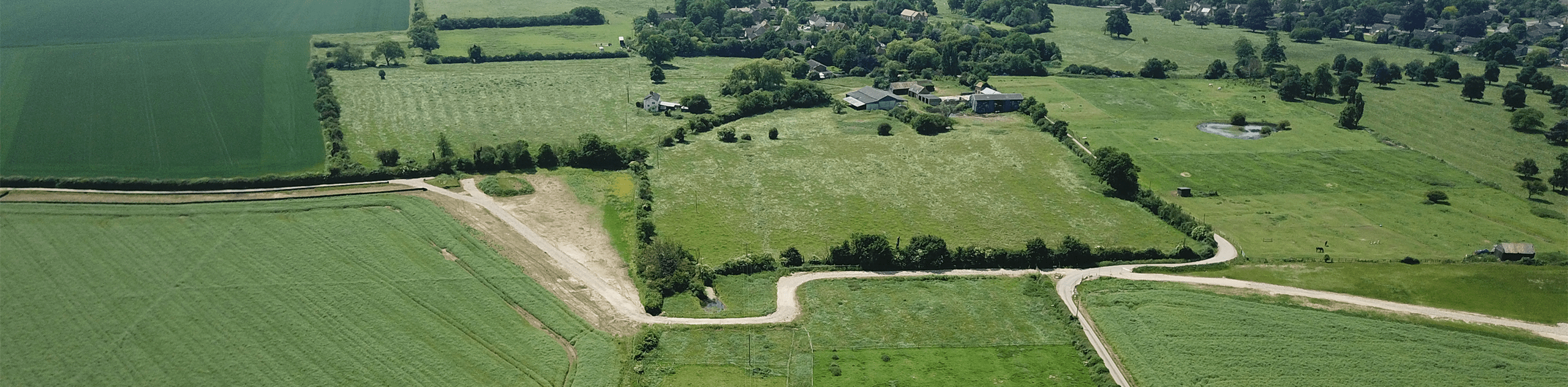An aerial photograph of Grange Farm and surrounding countryside. © BMD 