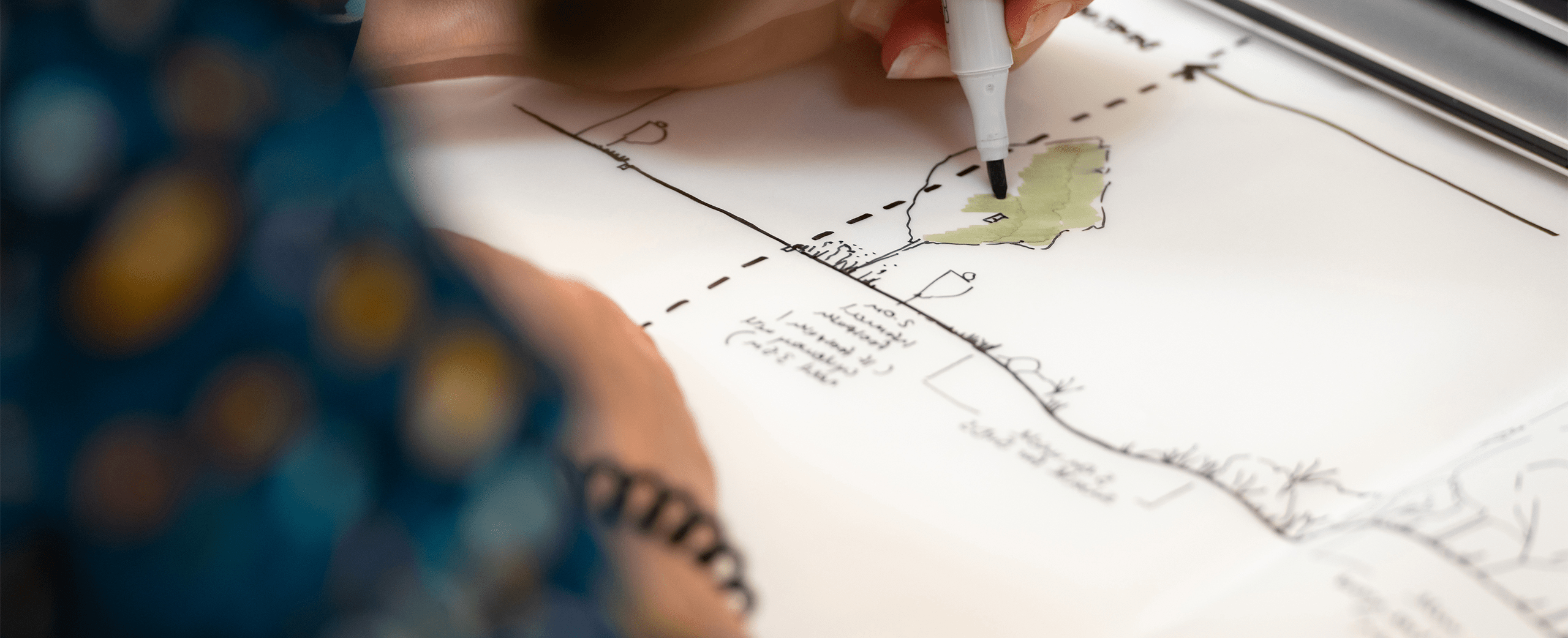 A photograph of a BMD employee illustrating a site section