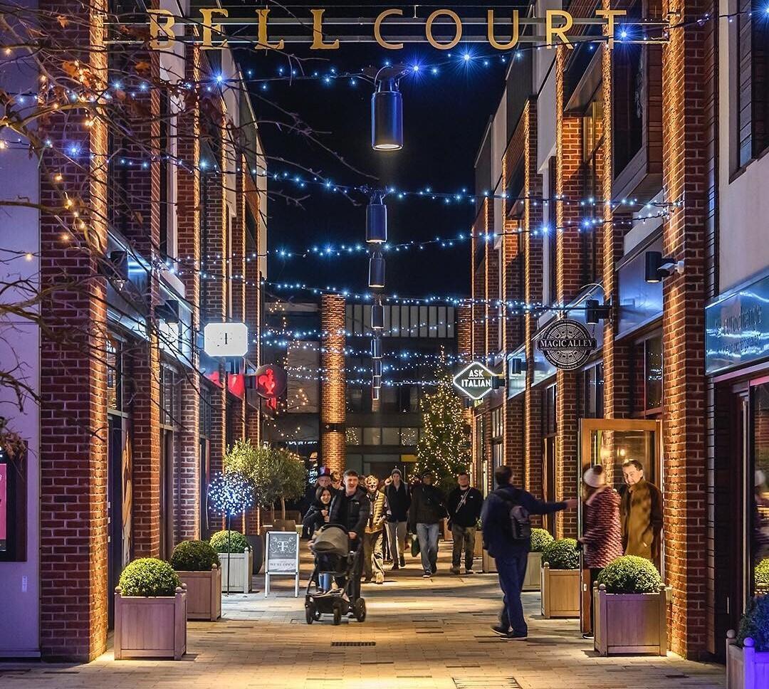 A photograph showing Bell Court lit at night. © www.bellcourtstratford.com