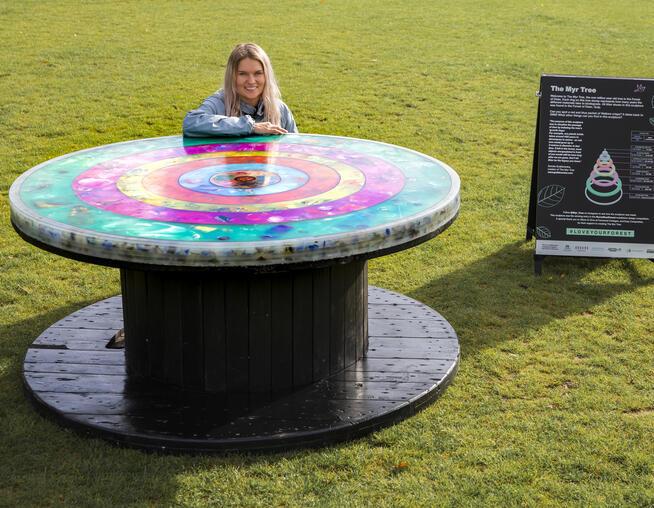 A BMD employee photographer with her award winning sculpture